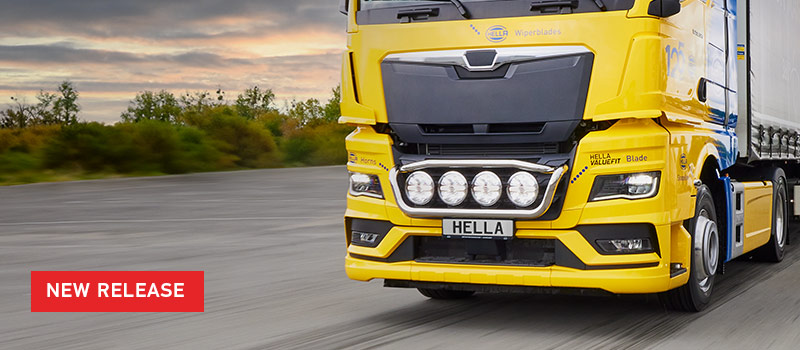 New Release text over image of HELLA branded yellow truck with Blade Driving Lights on front